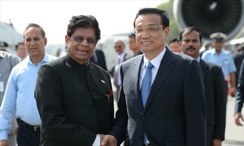 Chinese Premier Li Keqiang arrived in New Delhi on Sunday afternoon for the first leg of his maiden foreign trip since he became premier in March. Photo: Xinhua