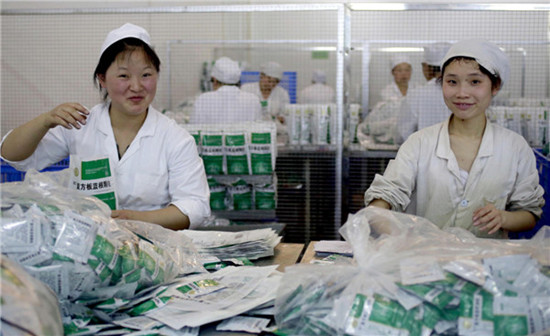 Workers in the packaging department of De Chang Xiang Co, one of the leading producers of traditional Chinese medicine in Guizhou province. Feng Yongbin / China Daily