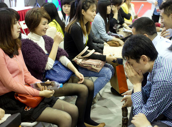 Young people hoping to find their 'better half' attend Shanghai's biggest matchmaking party, which was held in the city's Qingpu district on Saturday and Sunday. [Photo by Gao Erqiang / China Daily]