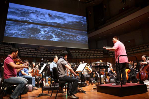 The last rehearsal for the World Environment Day concert, led by renowned Chinese conductor Lyu Jia, takes place at the National Center for the Performing Arts on Wednesday afternoon before a public performance that night. GAN YUAN / FOR CHINA DAILY 