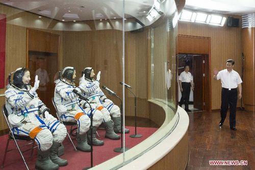 Chinese President Xi Jinping (R) attends a see-off ceremony for Chinese astronauts of an upcoming manned space mission at the astronauts' apartment building in the Jiuquan Satellite Launch Center in Jiuquan, northwest China's Gansu Province, June 11, 2012. The three astronauts are Nie Haisheng, Zhang Xiaoguang and Wang Yaping. (Xinhua/Li Xueren)  