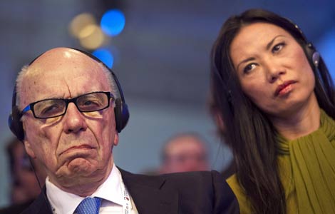 News Corporation CEO Rupert Murdoch and his wife Wendi Deng attend the eG8 forum in Paris in this May 24, 2011 file photo. [Photo: China Daily/Agencies]