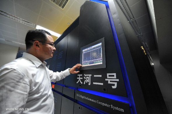 Photo taken on June 16, 2013 shows the supercomputer Tianhe-2 developed by China's National University of Defense Technology. The supercomputer Tianhe-2, capable of operating as fast as 33.86 petaflops per second, was ranked on Monday as the world's fastest computing system, according to TOP500, a project ranking the 500 most powerful computer systems in the world. (Xinhua/Long Hongtao)  