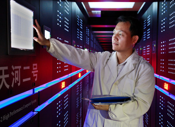 A technician checks the operation of the Tianhe-2 high performance computer system. HE SHUYUAN / FOR CHINA DAILY