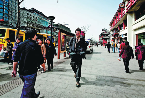 Christoph Rehage walks on the streets of Xi'an, Shaanxi province. Photos Provided to China Daily
