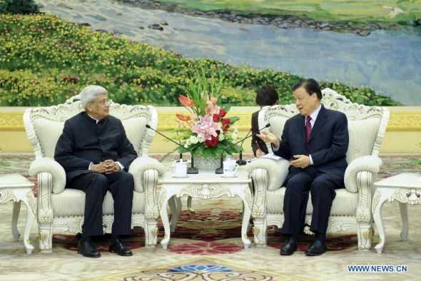 Liu Yunshan (R), a member of the Standing Committee of the Political Bureau of the Communist Party of China (CPC) Central Committee, meets with Prakash Karat, general secretary of Communist Party of India (Marxist) (CPI-M), in Beijing, capital of China, June 20, 2013. (Xinhua/Zhang Duo)