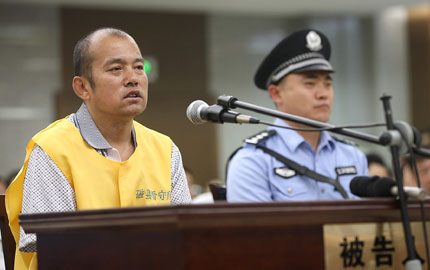 Wang Shujin is seen at yesterday's court hearing in north China's Shijiazhuang City. He said he was responsible for a rape and murder case that had led to another man being executed.