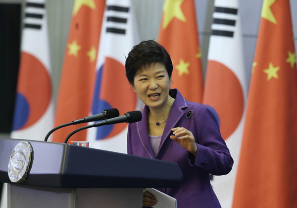 South Korea's President Park Geun-hye delivers an address at Tsinghua University during her state visit to China in Beijing June 29, 2013. [Xu Jingxing/China Daily] 