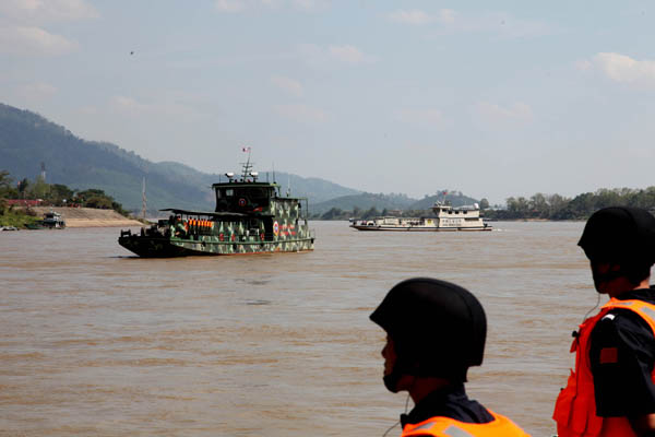 A fleet of law enforcement vessels patrol the Mekong River on May 17 in a four-day joint drill involving China, Laos, Myanmar and Thailand.