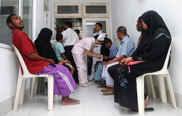 Residents of K. Guraidhoo wait to consult Chinese doctors from the Peace Ark. The hospital ship offered free medical treatment to locals between June 29 and July 5.