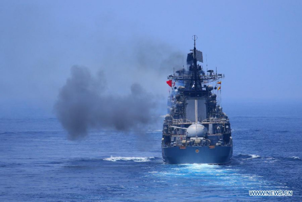 Russian naval vessel fires to a target during the Joint Sea-2013 drill at Peter the Great Bay in Russia, July 10, 2013. The Joint Sea-2013 drill participated by Chinese and Russian warships concluded here on Wednesday. (Xinhua/Zha Chunming) 