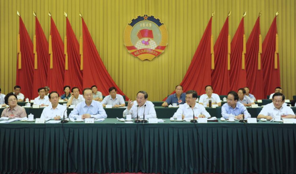 Yu Zhengsheng (C, front), a member of the Standing Committee of the Political Bureau of the Communist Party of China (CPC) Central Committee and chairman of the National Committee of the Chinese People's Political Consultative Conference (CPPCC), attends a meeting held by the CPPCC National Committee on coordinated development in urbanization as well as raising the quality of urbanization in Beijing, capital of China, July 16, 2013. (Xinhua/Xie Huanchi)
