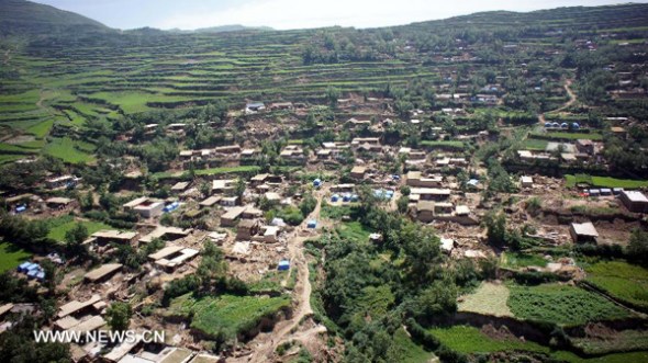 Aerial photo taken on July 23, 2013 shows quake-hit Yongguang Village of Minxian County, northwest China's Gansu Province. The death toll has climbed to 94 in the 6.6-magnitude earthquake which jolted a juncture region of Minxian County and Zhangxian County in Dingxi City Monday morning. (Xinhua/Ma Jun) 