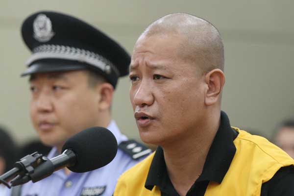 Lyu Yueting stands trial at a court in Hebei on Tuesday. Ding Lixin / FOR CHINA DAILY