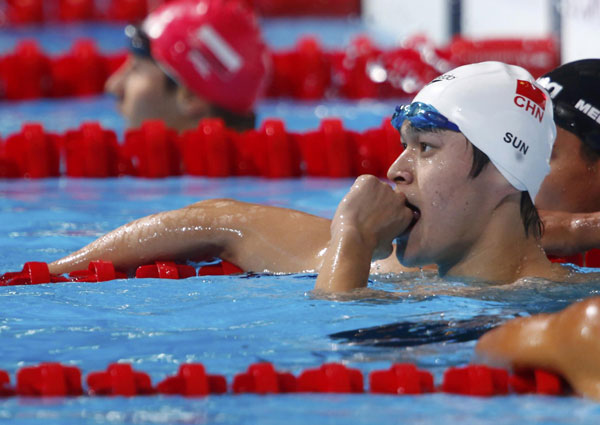 Sun Yang of China reacts after competing in the men's 800m freestyle heats during the World Swimming Championships at the Sant Jordi arena in Barcelona, July 30, 2013. [Photo/Agencies]