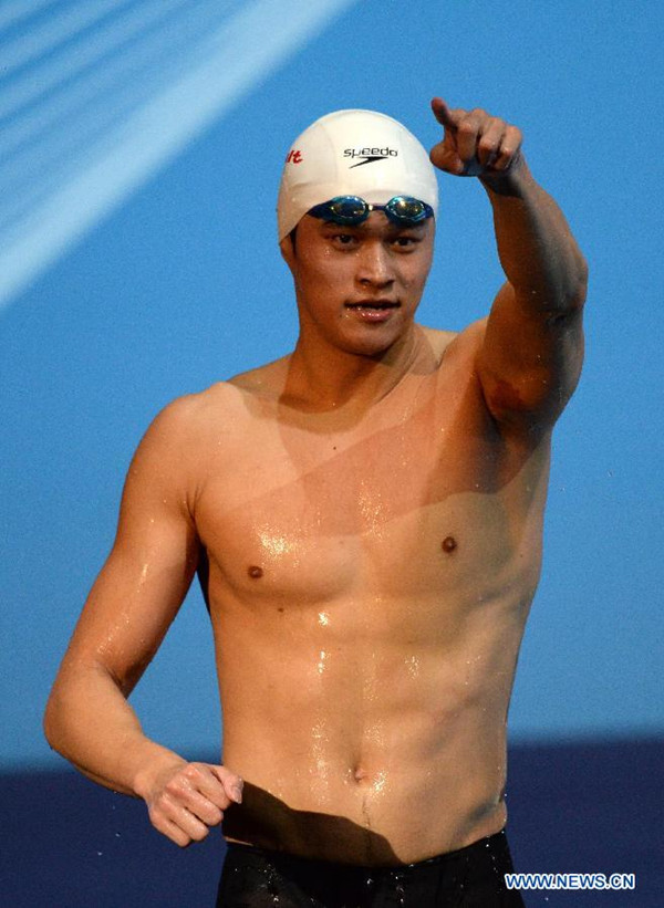 China's Sun Yang reacts after the final of the men's 1500-metre freestyle swimming competition in the FINA World Championships in Barcelona on Aug. 4, 2013. Sun Yang won the 3rd gold of World Championship with 1,500 meter freestyle triumph. (Xinhua/Xie Haining)