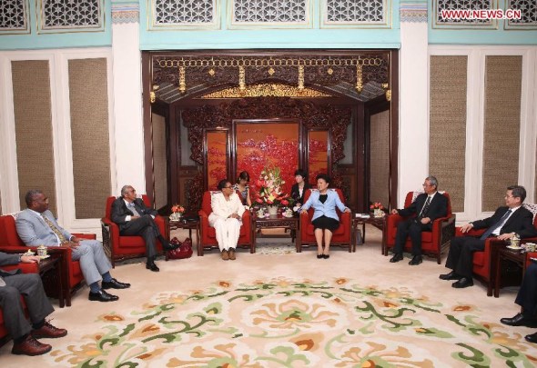 Chinese Vice Premier Liu Yandong (3rd R) meets with a U.S. lawmakers delegation, which is headed by Marcia Fudge, chair of the Congressional Black Caucus, in Beijing, capital of China, Aug. 5, 2013. (Xinhua/Liu Weibing)