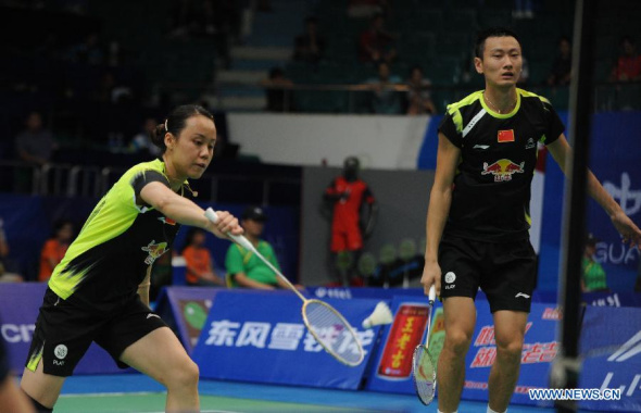 Zhang Nan and Zhao Yunlei (L) from China compete during the mixed double match against Anthony Dumarthery and Sabrina Jaquet of Swiss at the 2013 BWF World Championships on Aug. 6, 2013. Zhang Nan and Zhao Yunlei won 2-0. (Xinhua/Mao Siqian)