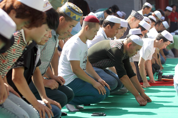 Muslims attend Eid al-Fitr morning prayers at the Niujie Mosque in Beijing.Zou Hong / China Daily