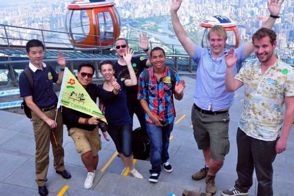Guangzhou's first foreign 72-hour visa-free tour group visits Canton Tower on Tuesday. The city became the third in the Chinese mainland after Beijing and Shanghai to offer 72-hour visa-free transit to airline passengers. [XU RONG / FOR CHINA DAILY]