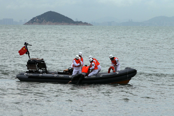 Members on the Nanhai Rescue Bureau conduct a drill in July. Photo by Wang Jing / China Daily