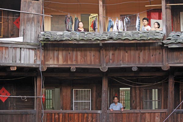 Residents are proud to live in the tulou. 