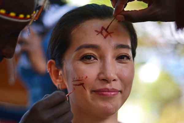 United Nations Environment Programme goodwill ambassador and Chinese actress Li Bingbing is given temporary tribal markings by a member of the Samburu tribe in May.Carl de Souza / Agence France-Presse