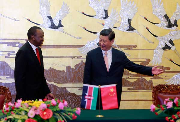 President Xi Jinping and his Kenyan counterpart Uhuru Kenyatta attend a signing ceremony for cooperative agreements between the two countries in the Great Hall of the People in Beijing on Monday. PHOTO BY FENG YONGBIN /CHINA DAILY