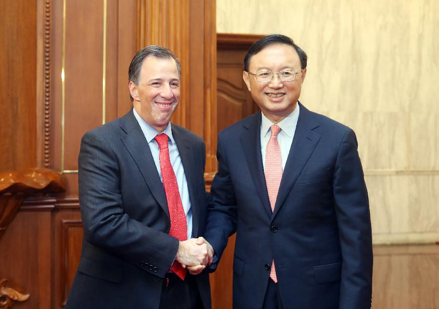 Chinese State Councilor Yang Jiechi (R) shakes hands with Mexican Secretary of Foreign Relations Jose Antonio Meade in Beijing, capital of China, Aug. 19, 2013. Yang on Monday met with a delegation led by three Mexican ministers, including Meade, Secretary of Communications and Transportation Gerardo Ruiz Esparza and Secretary of Tourism Claudia Ruiz Massieu Salinas. (Xinhua/Yao Dawei) 