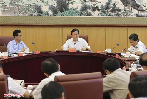Liu Yunshan (C), a member of the Standing Committee of the Political Bureau of the Communist Party of China (CPC) Central Committee, addresses a symposium of the mass line educational campaign of the CPCCentral Committee, in Beijing, capital of China, Aug. 26, 2013. The CPC in June initiated the year-long campaign to strengthen themass line, referring to a guideline under which the CPC is required to prioritize the interests of the people. (Xinhua/RaoAimin) 