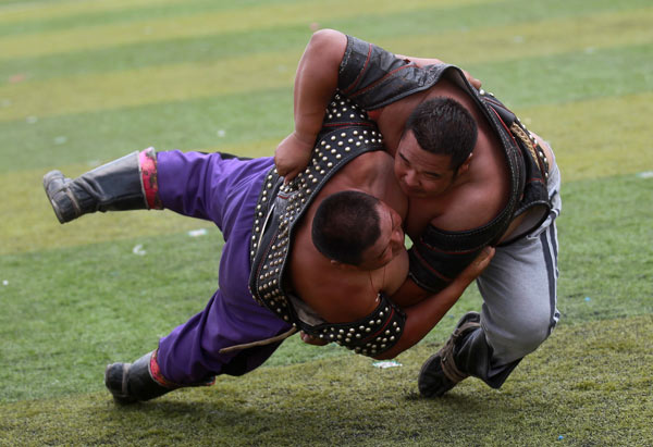 Wrestling is one of the 'three manly skills' of the Mongolian ethnic group. The sport, along with horsebacking riding and archery, forms the basis of the competition at the annual Nadaam festivals. Photos by Cui Meng / China Daily