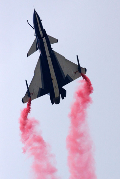 The People's Liberation Army's August 1st Aerobatics Team performs at the MAKS-2013 air show in Zhukovsky on Friday. SHEN JINKE / FOR CHINA DAILY