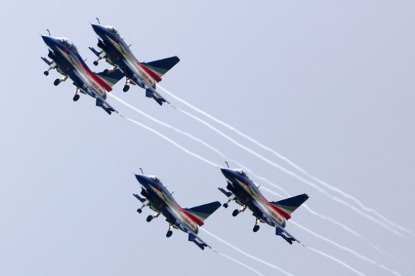 The People's Liberation Army's August 1st Aerobatics Team performs at the MAKS-2013 air show in Zhukovsky on Friday. SHEN JINKE / FOR CHINA DAILY