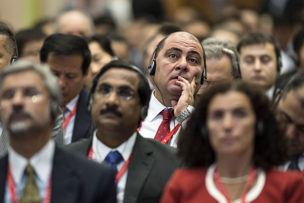 Participants listen to speeches delivered at the opening ceremony of the third China-Eurasia Expo as well as its economic development and cooperation forum in Urumqi, capital of the Xinjiang Uygur autonomous region, on Monday. Wang Fei / Xinhua