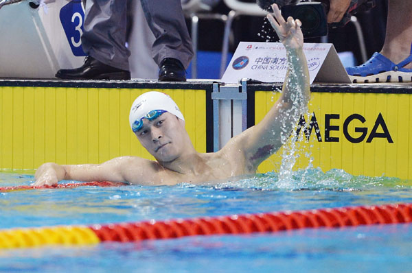 Sun Yang celebrates after winning the men's 400m freestyle final at the National Games in Shenyang, Liaoning province, Sept 4, 2013. [Photo/Xinhua]