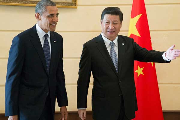 President Xi Jinping meets with his US counterpart Barack Obama in St. Petersburg, Russia, on Friday. It was their second meeting in three months. [Ju Peng / Xinhua]