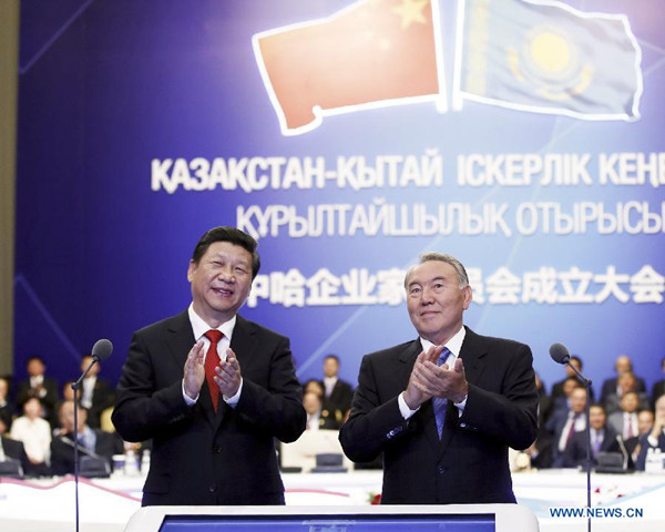 Chinese President Xi Jinping (L) and his Kazakh counterpart Nursultan Nazarbayev attend the establishment ceremony of the China-Kazakhstan Entrepreneurs Committee in Astana, Kazakhstan, Sept. 7, 2013. (Xinhua/Ju Peng)