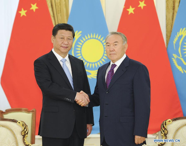 Chinese President Xi Jinping (L) shakes hands with his Kazakh counterpart Nursultan Nazarbayev prior to their talks in Astana, Kazakhstan, Sept. 7, 2013. (Xinhua/Xie Huanchi)