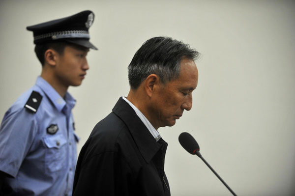 Zhang Shuguang, former director of the transport bureau for Ministry of Railways, stands trial at a Beijing court, Sept 10, 2013. [Photo/Xinhua] 