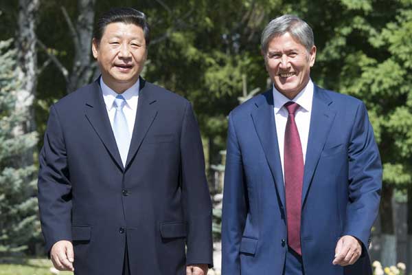 President Xi Jinping meets his Kyrgyz counterpart Almazbek Atambaev in Kyrgyzstan's capital Bishkek on Wednesday. Both leaders pledged to upgrade bilateral economic cooperation and achieve common development based on the principle of equality and mutual benefit. PHOTO BY Huang Jingwen / Xinhua 