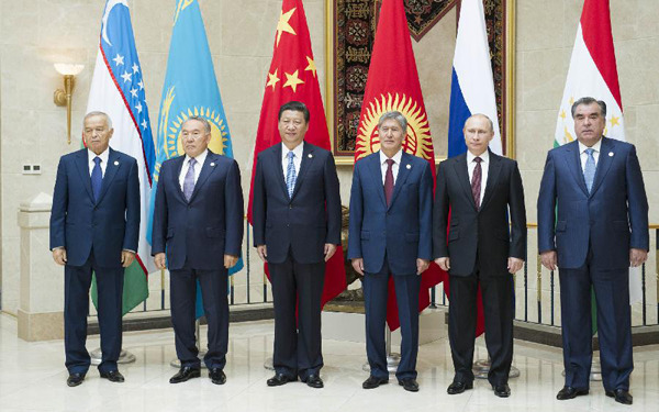 The leaders of the Shanghai Cooperation Organization (SCO) members pose for group photo in Bishkek, Kyrgyzstan, Sept. 13, 2013. (Xinhua/Huang Jingwen)