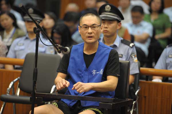 Han Lei, who is accused of murdering a 2-year-old girl after quarreling with the childs mother in Beijing on July 23, stands trial at Beijing No 1 Intermediate Peoples Court on Monday. PROVIDED TO CHINA DAILY