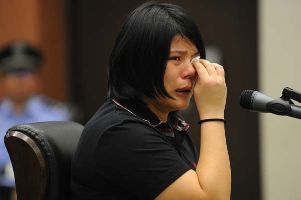 Yue Yan, 22, who was found guilty of allowing her daughters starve to death after leaving them at home with the door and windows shut, appears at a court in Nanjing on Wednesday. [Xu Gaochun / for China Daily ]