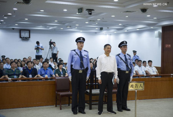  Bo Xilai (C), former secretary of the Chongqing Municipal Committee of the Communist Party of China (CPC) and a former member of the CPC Central Committee Political Bureau, is sentenced to life imprisonment for bribery, embezzlement and abuse of power, at the Jinan Intermediate People's Court in Jinan City, capital of east China's Shandong Province, Sept. 22, 2013. He was deprived of political rights for life. The court announced the verdict. (Xinhua/Xie Huanchi)