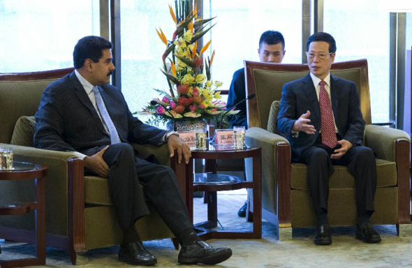 Chinese Vice Premier Zhang Gaoli (R) meets with Venezuelan President Nicolas Maduro before the closing ceremony of the 12th meeting of the China-Venezuela High-Level Joint Commission in Beijing, capital of China, Sept. 22, 2013. (Xinhua/Wang Ye)