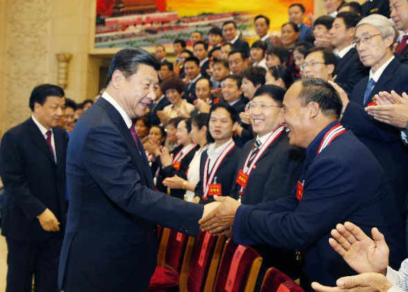 Chinese President Xi Jinping and other leaders meet with winners and nominees of the 4th selection of the national moral models in Beijing, capital of China, Sept. 26, 2013. (Xinhua/Ju Peng)