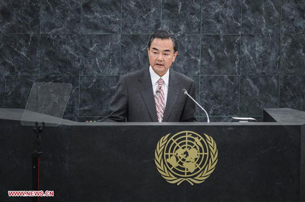 Chinese Foreign Minister Wang Yi speaks during the general debate of the 68th session of the United Nations General Assembly, at the UN headquarters in New York, on Sept. 27, 2013. (Xinhua/Niu Xiaolei)  