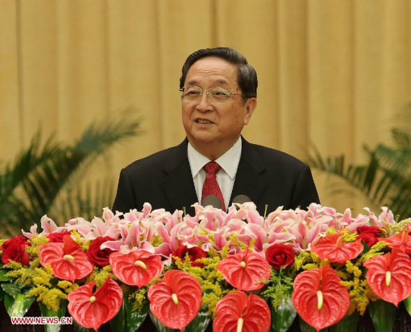 Yu Zhengsheng, chairman of the National Committee of the Chinese People's Political Consultative Conference (CPPCC), addresses a reception marking the 64th anniversary of the founding of the People's Republic of China, in Beijing, capital of China, Sept. 29, 2013. More than 2,800 representatives from Hong Kong, Macao, Taiwan and overseas Chinese communities attended the reception. The reception was jointly organized by the General Office of the CPPCC National Committee, the United Front Work Department of the CPC Central Committee, the Overseas Chinese Affairs Office of the State Council, the Hong Kong and Macao Affairs Office of the State Council and the Taiwan Affairs Office of the State Council. (Xinhua/Liu Weibing)