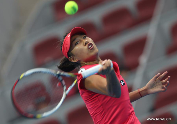 Zhang Shuai of China hits a return during her women's singles match against her compatriot Peng Shuai at China Open tennis tournament in Beijing, Sept. 30, 2013. Zhang Shuai won 2-0.(Xinhua/Meng Yongmin)