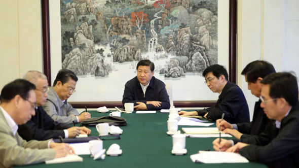 Xi Jinping (C), Chinese president and general secretary of the Communist Party of China Central Committee, participates in a session as part of the ongoing mass line campaign with standing committee members of the Party Committee of North China's Hebei province, in Shijiazhuang, the capital of Hebei, Sept 23, 2013 file photo. [Photo/Xinhua]
